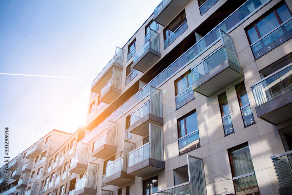 Modern apartment building exterior concept. Sunshine sun flare. Modern apartment building exterior concept. Sunshine sun flare.