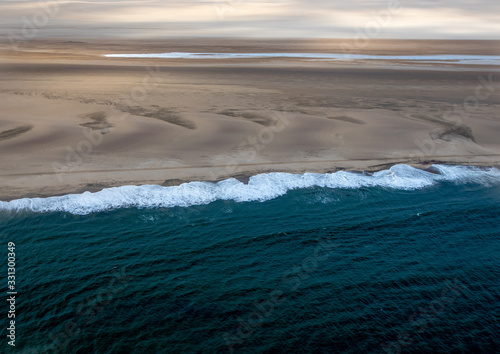 Aerial picture of the landscape of the Namib Desert and the Atlantic Ocean on the Skeleton Coast in western Namibia