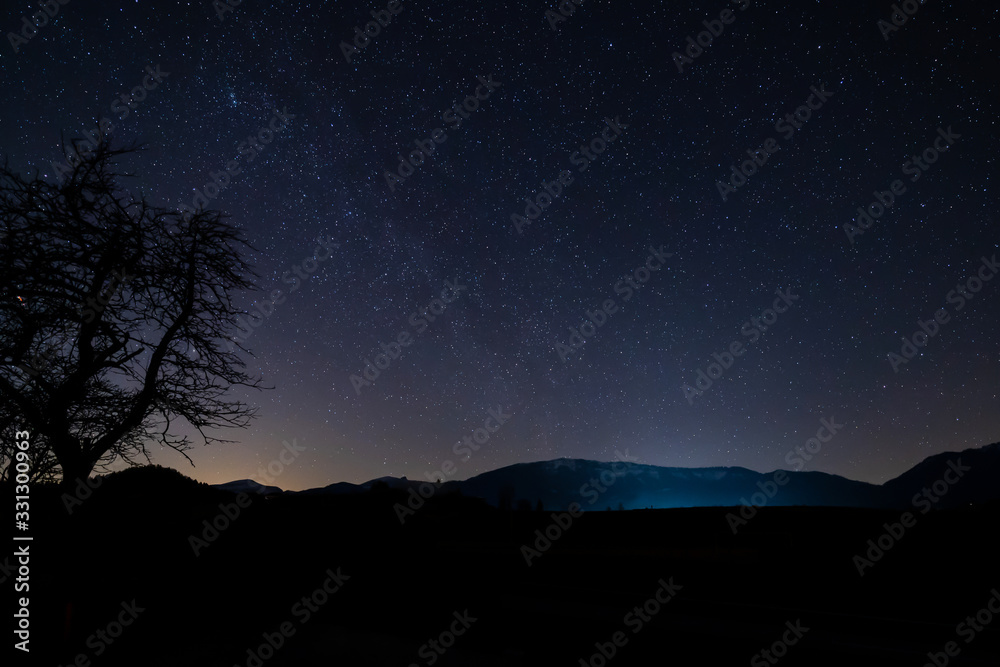 Mountains at night with stars