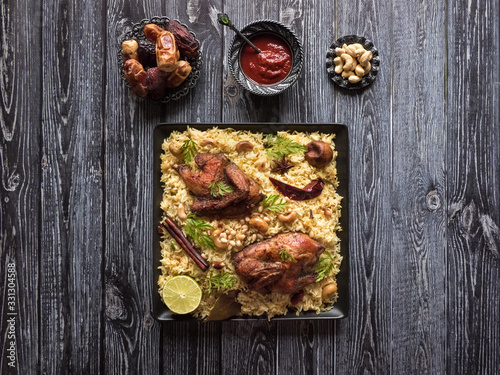 Festive dish with baked chicken and rice. Mandi Kabsa, Yemenis style