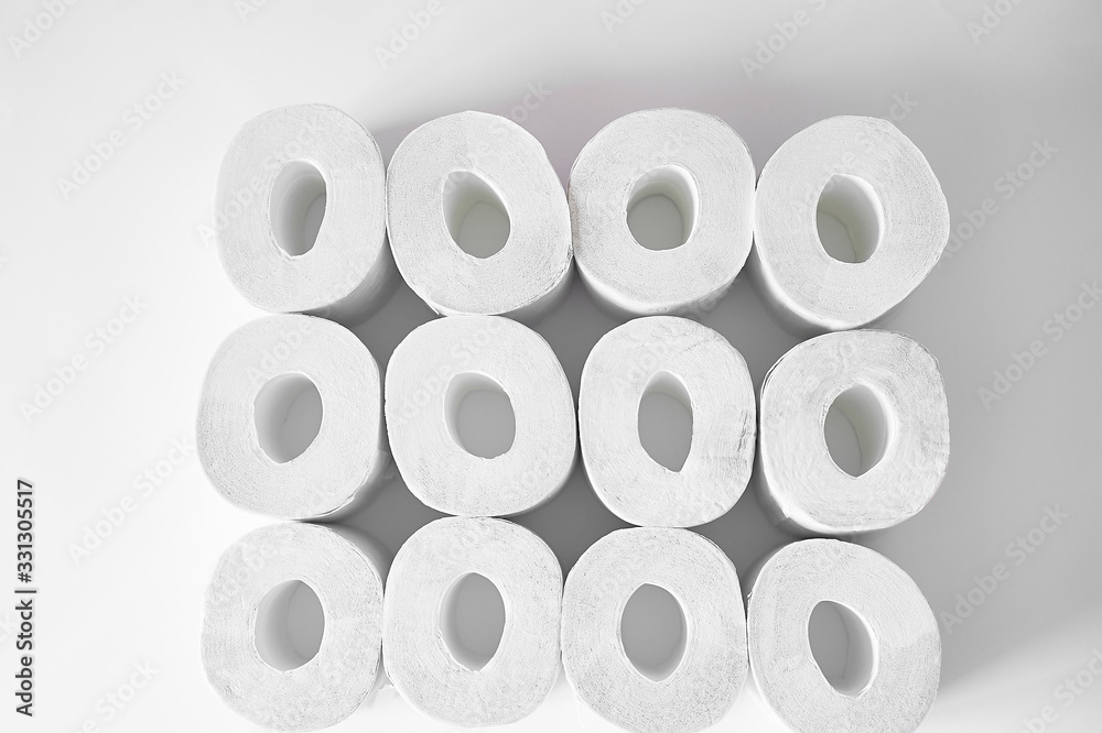 Toilet paper on a white background, essential goods. Texture. Toilet paper on a white background, essential goods. Texture.