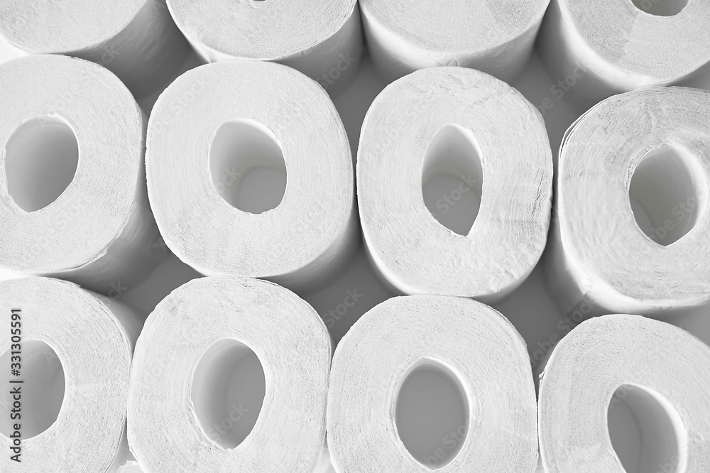 Toilet paper on a white background, essential goods. Texture. Toilet paper on a white background, essential goods. Texture.