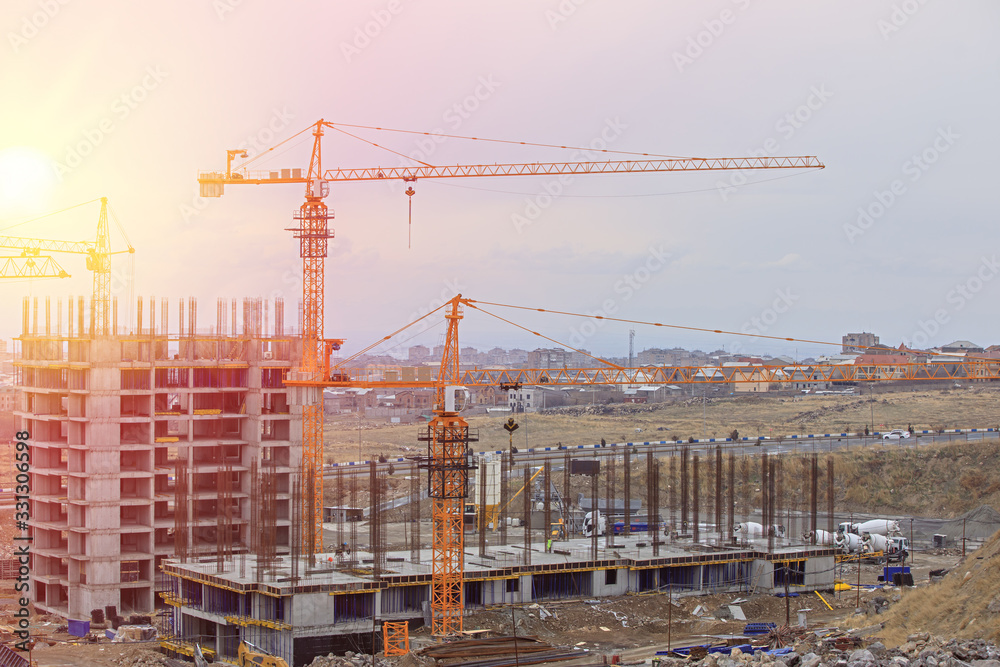 development construction site with lot of cranes