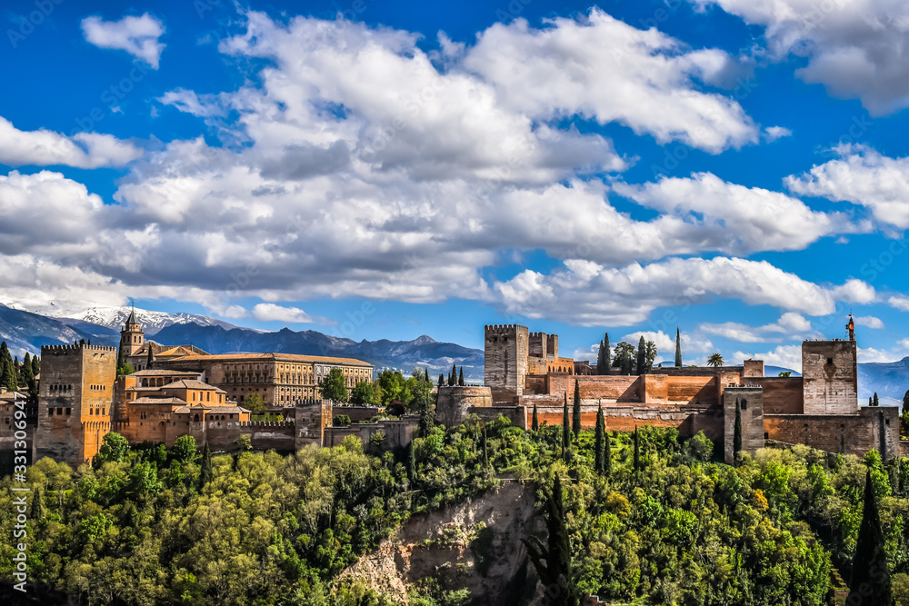 Wallpaper landscape of La Alhambra, Granada, Spain, with clouds and a blue  sky
