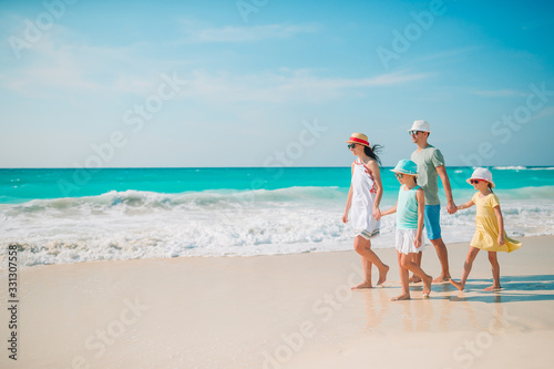 Happy beautiful family on a tropical beach vacation