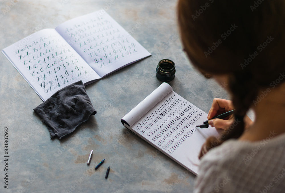 Naklejka premium White girl practicing lettering