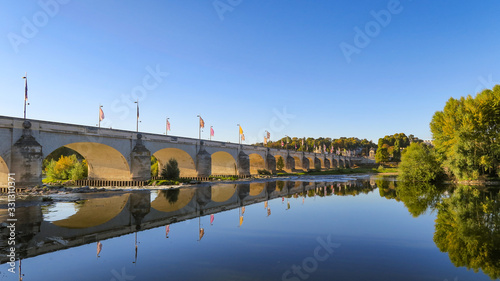 Beautiful view of the Wilson bridge and its reflection in the Loire river in Tours, France