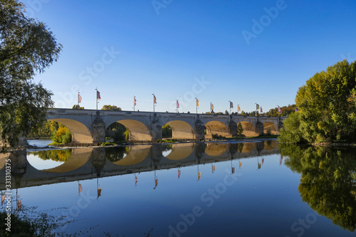 Beautiful view of the Wilson bridge and its reflection in the Loire river in Tours, France photo