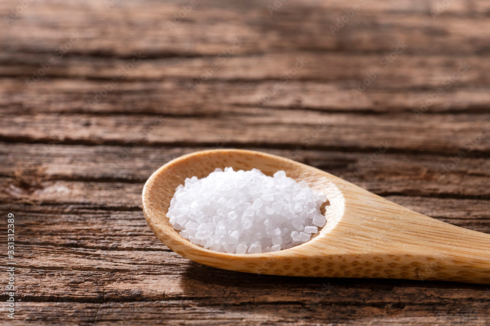 Sea salt crystals - Wood background Sea salt crystals - Wood background