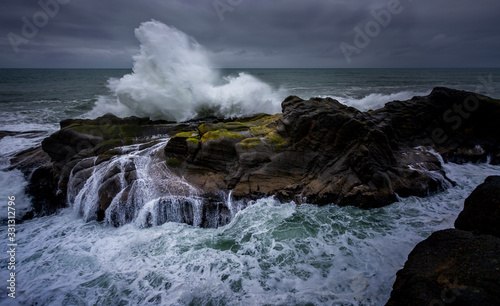 Waves crashing on rocks on the Pacific Ocean
