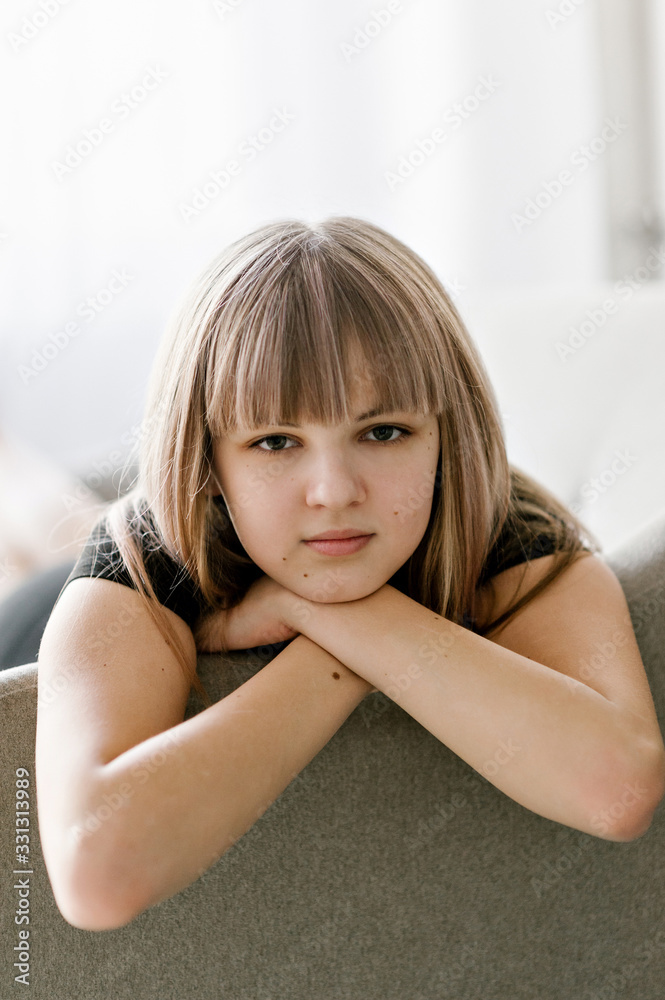 Close-up portrait of a beautiful teenage girl of the European race. Studio photo shoot. Photo with blurred background. Close-up portrait of a beautiful teenage girl of the European race. Studio photo shoot. Photo with blurred background.