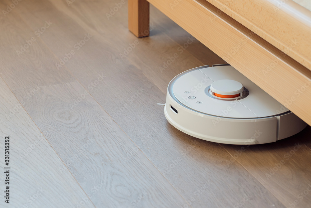 Robot vacuum cleaner performs automatic cleaning of the apartment Robot vacuum cleaner performs automatic cleaning of the apartment