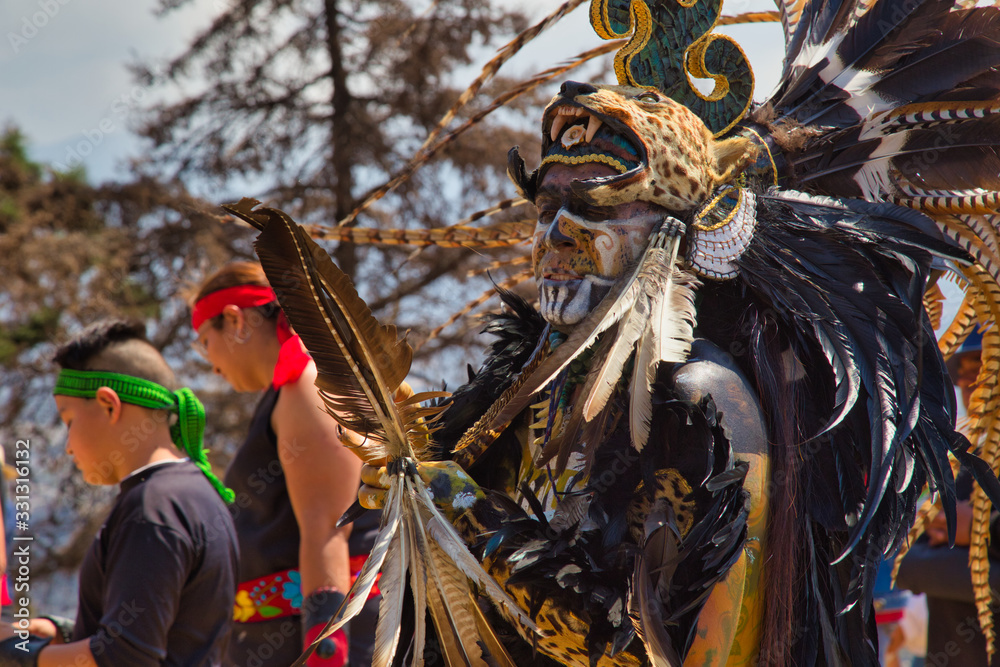 Señor Del Sacromonte Amecameca - February 27, 2020: Aztec dancers dancing in the Parque nacional Sacromonte