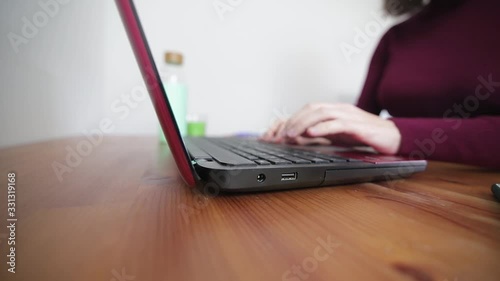 girl writing on the computer, teleworking