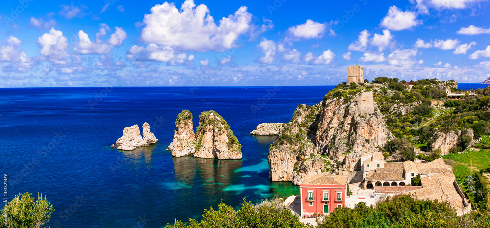 Summer holidays in Sicily island - beautiful scenic beach Scopello with impressive rocks in the sea. Italy