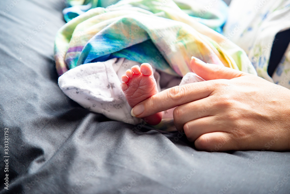 Newborn baby foot dry, wrinkled, cracked, peeling skin. Overdue vernix