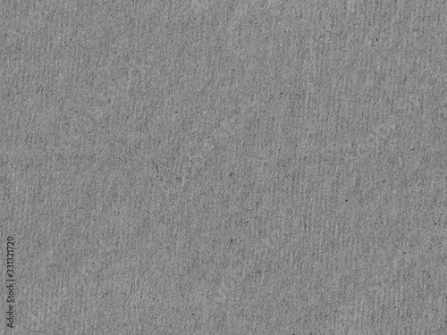 Seamless gray thick paper or cardboard with rough fibrous texture. Handmade designer paper for cards. Texture of gray cardboard in high quality and resolution.