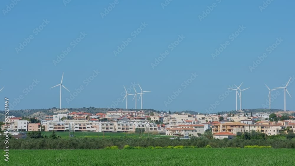 This video shows rows of wind turbines spinning behind a town in Cyprus.
This video shows rows of wind turbines spinning behind a town in Cyprus.