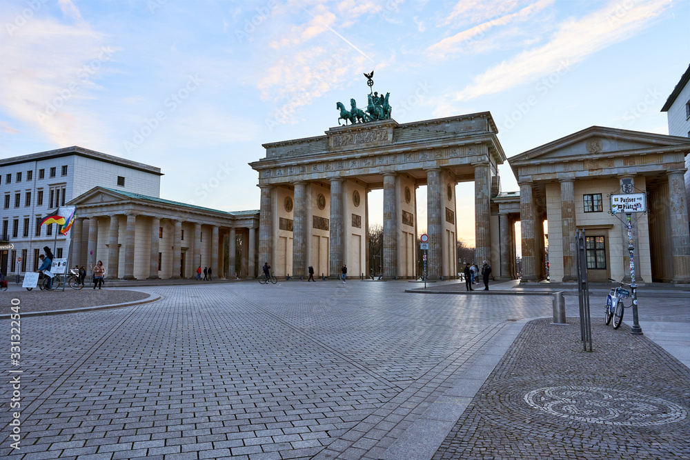 Fototapeta premium Brandenburg Gate at Parisian Squre in the sunset, Empty Square without tourists, visitors or other peoples 