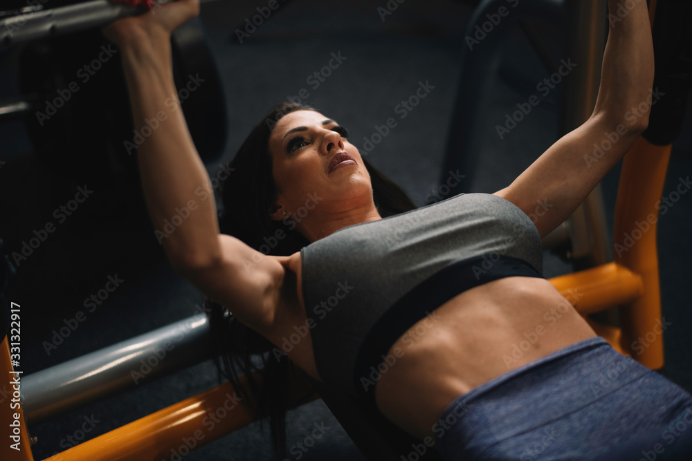 Fitness woman on training. Young woman in the gym. Fitness woman on training. Young woman in the gym.