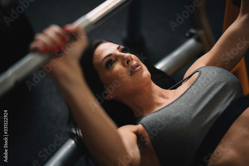  Fitness woman on training. Young woman in the gym.