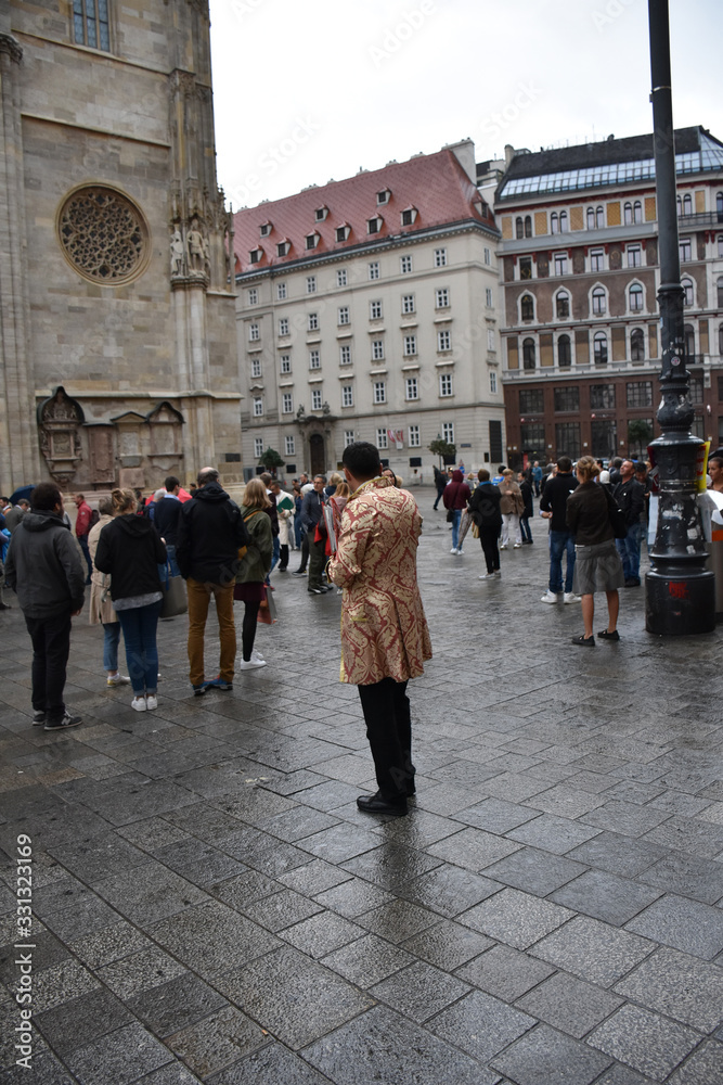 Promoter and lots of tourists in Vienna city square