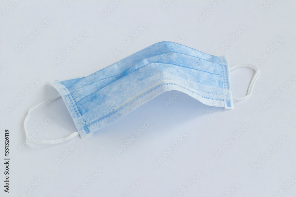 Three ply structure,single use hygenic face mask on white background with copy space. Three ply structure,single use hygenic face mask on white background with copy space.