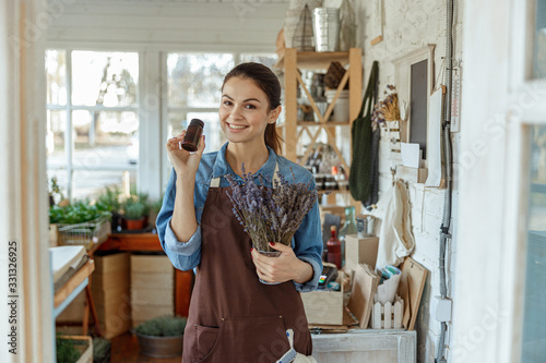 Woman with a small metal bucket of flowers
