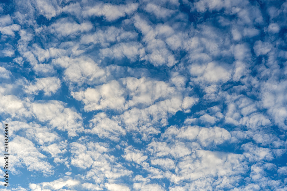 White clouds on a blue sky background