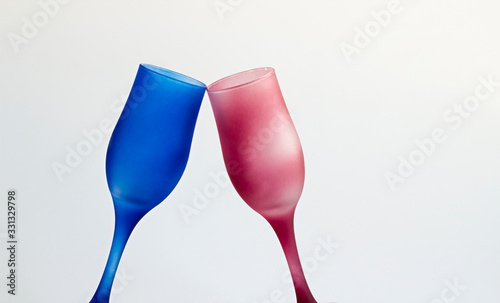 Cheers with two champagne glasses on the white background with copy space.Horizantal view.
