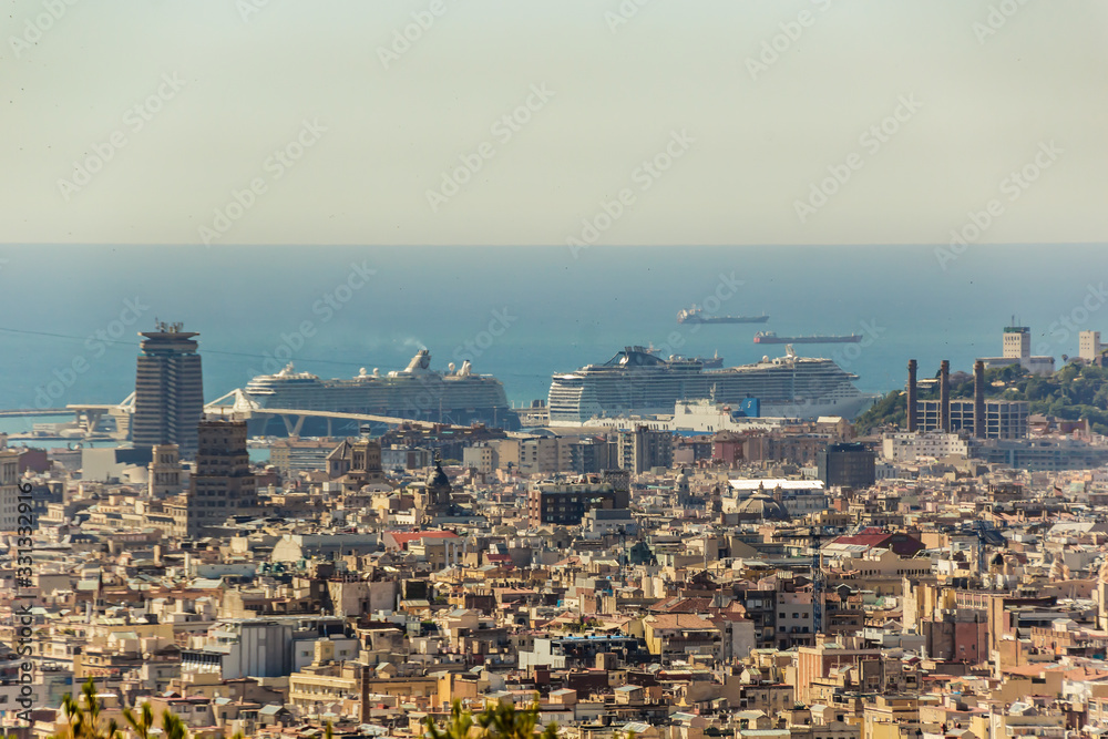 BARCELONA, SPAIN - JUNE 22, 2016: Aerial view of Barcelona Port from the top of Park Guell. Beautiful summer day with clear blue sky