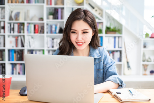 student using laptop at home