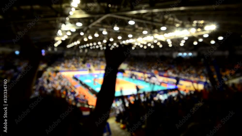 Blurry video of cheering team enjoy in volleyball game in indoor
