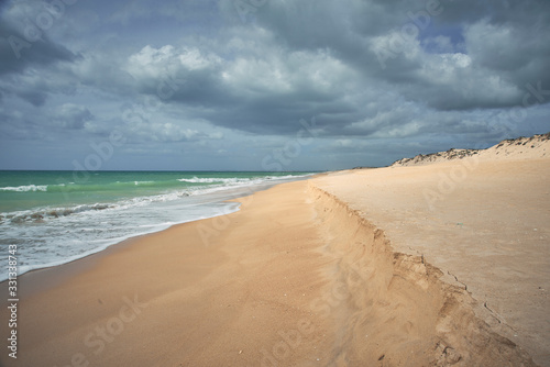 Faro, Algarve / Portugal - March 07, 2020: Atlantic ocean view. Typical beach in Algarve. Praia da Quinta do Lago
