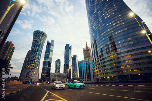 Futuristic modern skyscrapers in financial district at twilight in Doha, Qatar