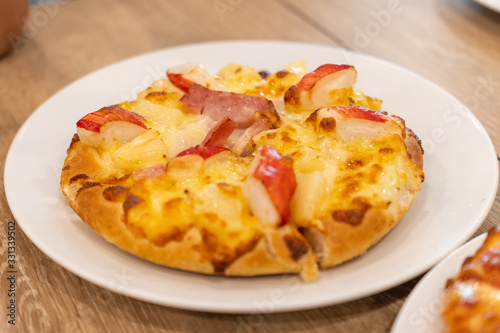 Pizza Hawaiian with pineapple and ham
