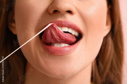 Young woman with chewing gu...