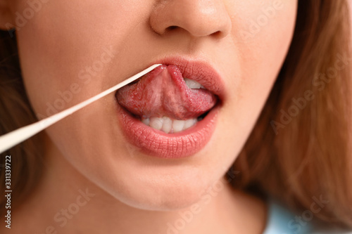 Young woman with chewing gu...