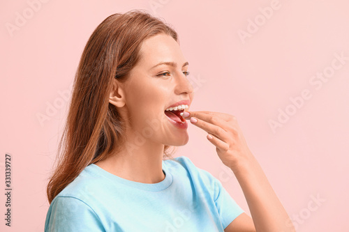 Young woman with chewing gu...