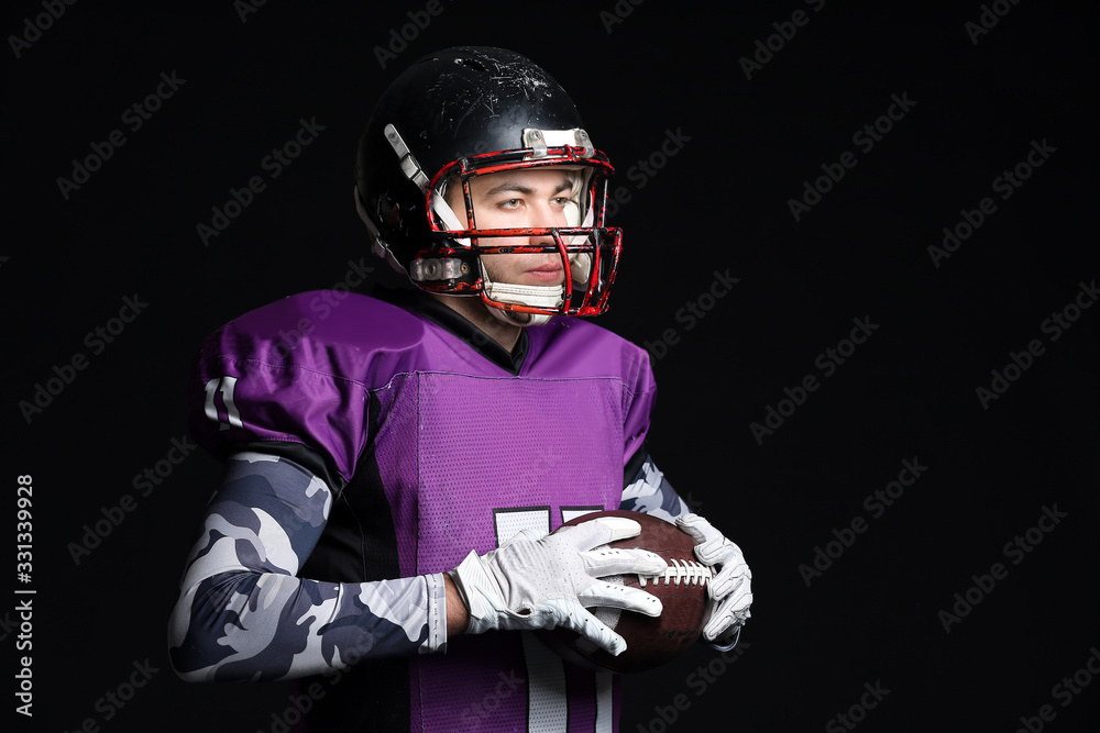 American football player on dark background