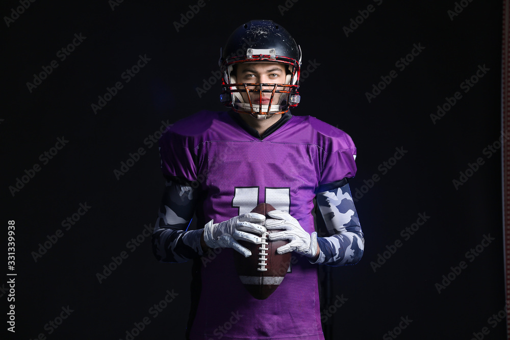 Fototapeta American football player on dark background