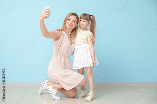 Woman and her little daught...