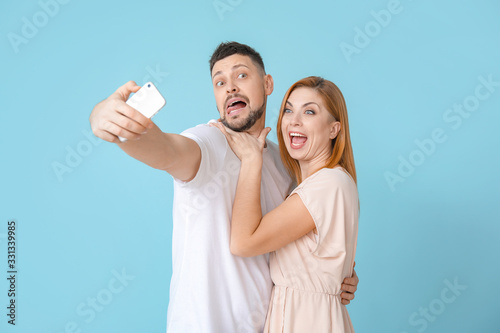 Couple taking selfie on col...