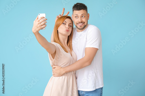 Couple taking selfie on col...