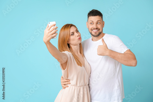 Couple taking selfie on col...