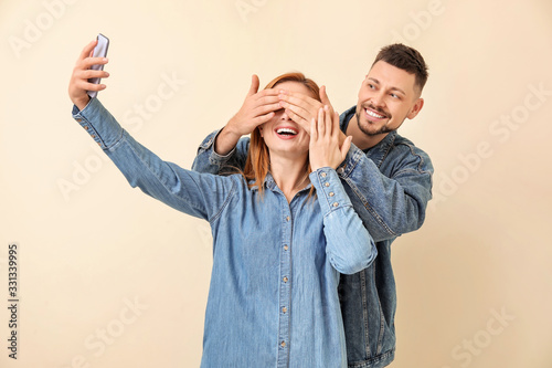 Couple taking selfie on lig...