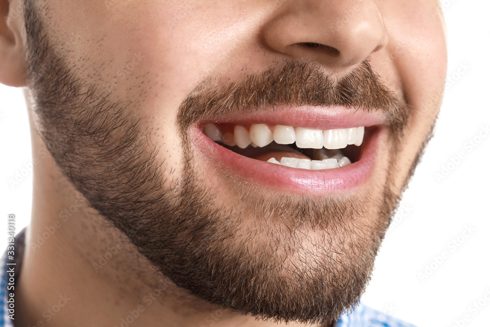 Handsome smiling young man on white background, closeup Handsome smiling young man on white background, closeup
