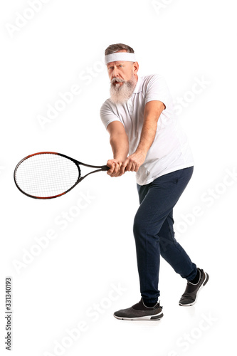 Elderly tennis player on white background © Pixel-Shot