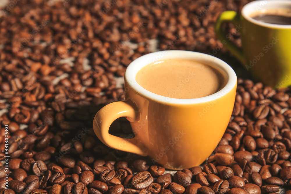 Cup of hot coffee on beans Cup of hot coffee on beans
