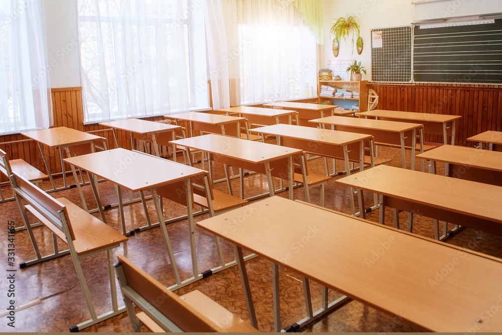 Interior of an empty school classroom. Concept of coronavirus COVID-19 quarantine in schools and educational institutions Interior of an empty school classroom. Concept of coronavirus COVID-19 quarantine in schools and educational institutions